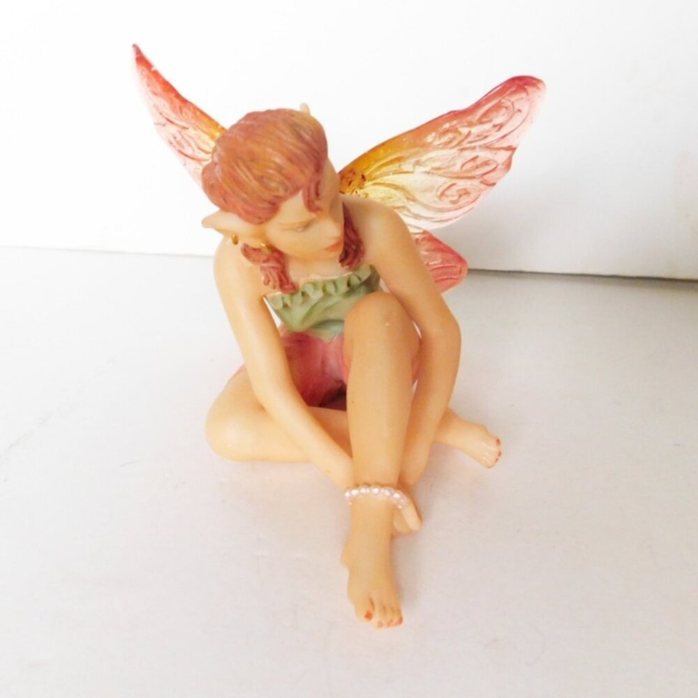 Seated green pink faerie VGU
